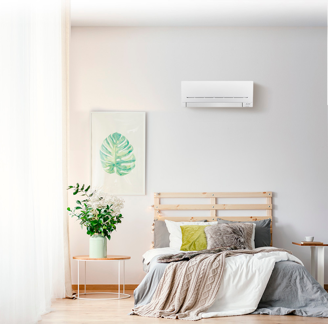 A well-designed bedroom featuring a wall-mounted heat pump, enhancing comfort and energy efficiency.