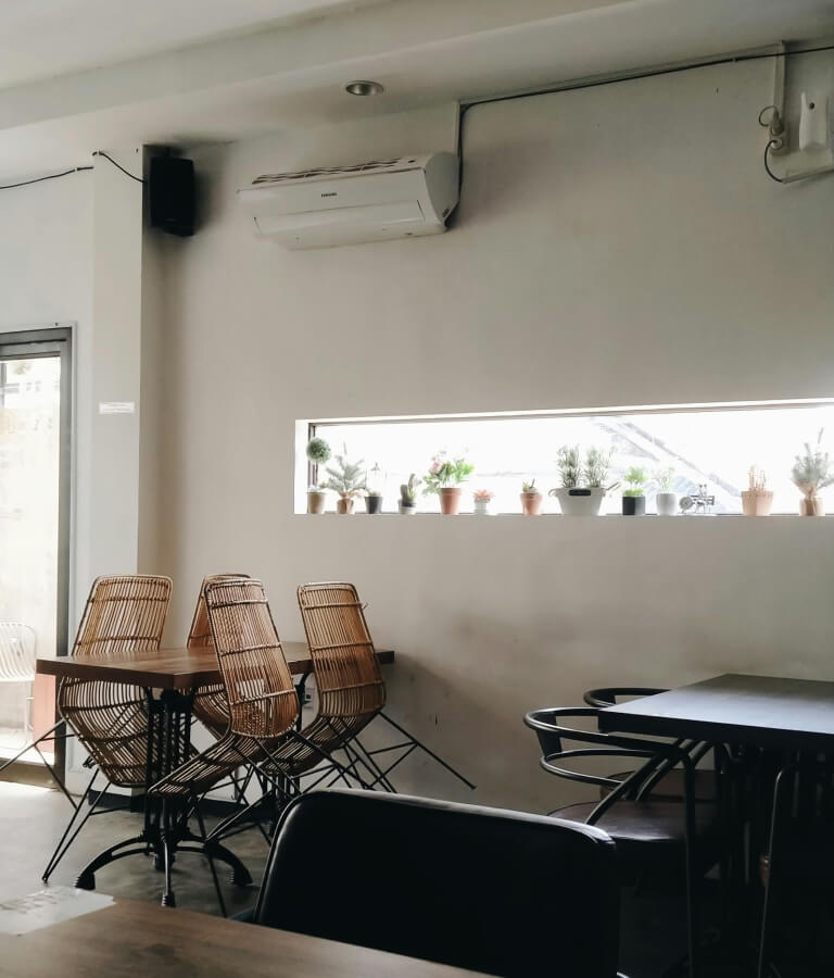Cafe with an air conditioning unit on the wall.