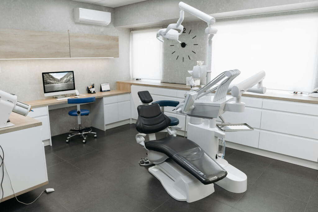 Dental office with air conditioning unit on the back wall.
